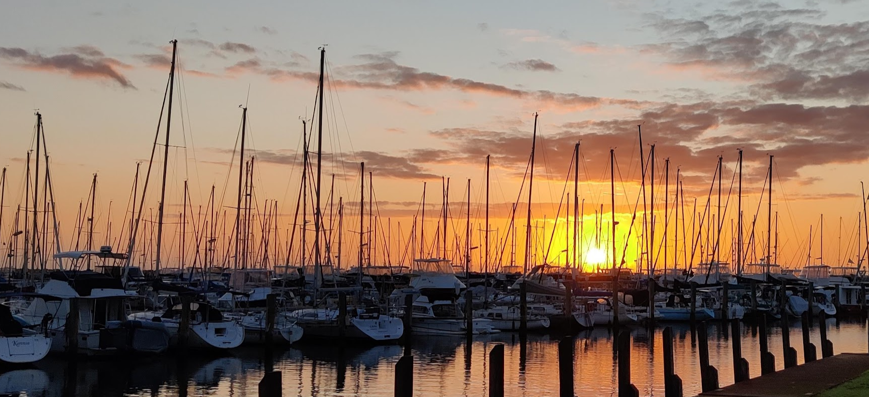 Silhouettes of yachts at sunset